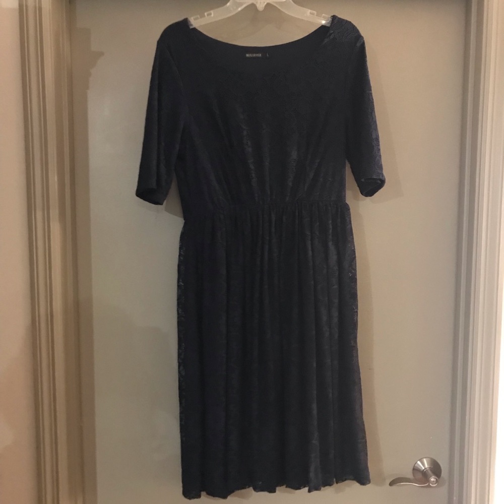 Navy blue lace dress. Full skirt. 3/4 sleeves.